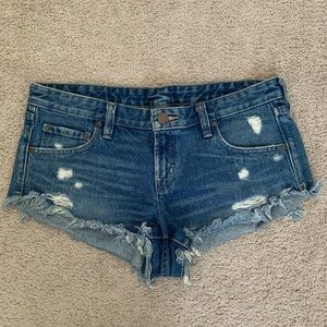 UO BDG Dolphin Low Rise Distressed Raw Hem Shorts